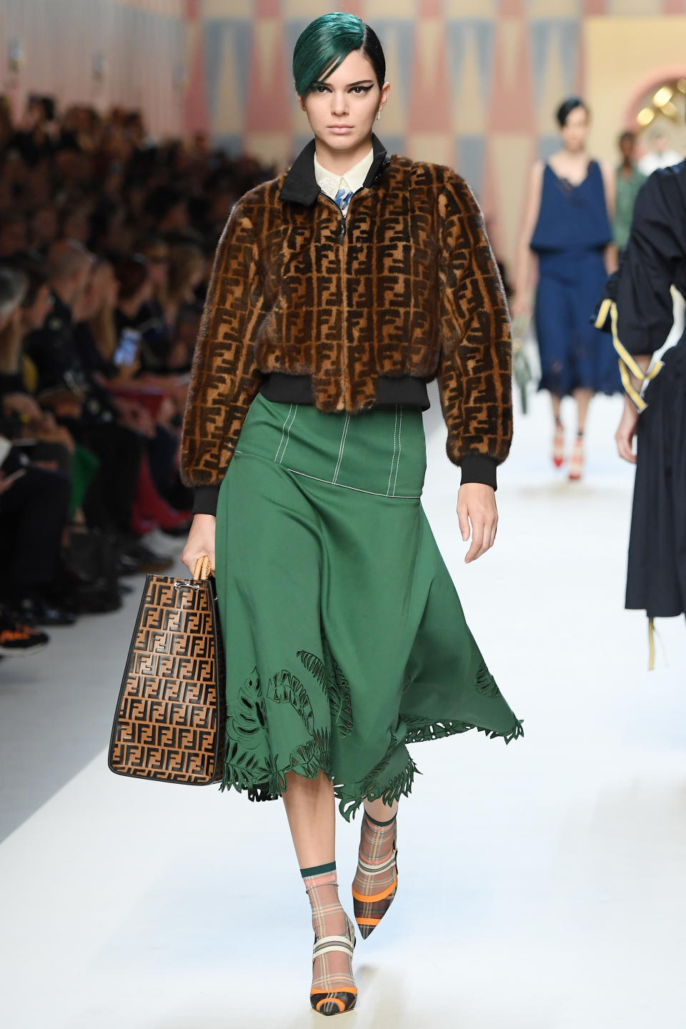 <p>Kendall matched her green hair to her skirt at Fendi.</p>