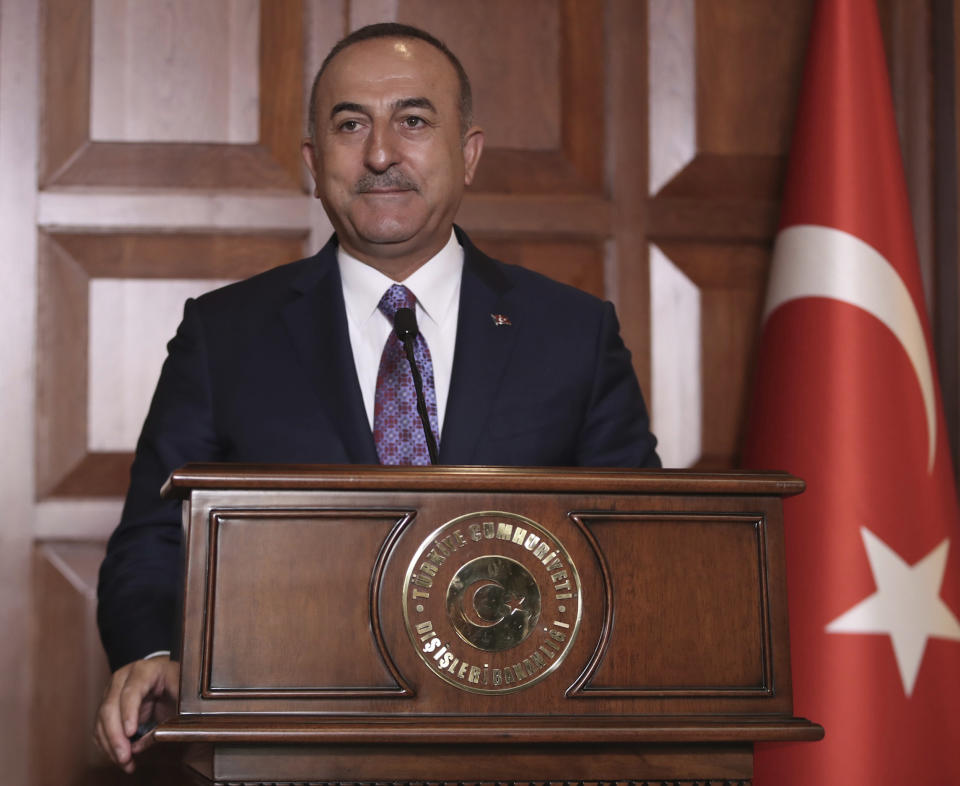 Turkish Foreign Minister Mevlut Cavusoglu speaks to journalists, in Ankara, Turkey, Tuesday, Sept. 10, 2019. Turkey on Tuesday accused the United States of taking "cosmetic steps" toward the creation of a so-called "safe zone" in northeast Syria, renewing a threat for a unilateral military intervention to form a buffer zone along its border. (Turkish Foreign Ministry via AP, Pool)