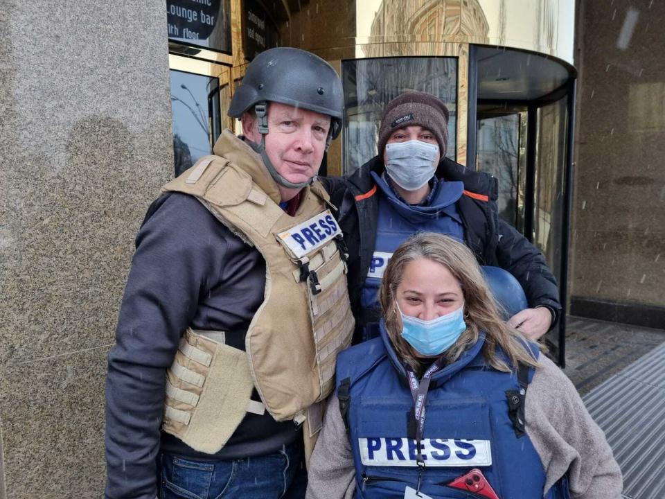 This image released by Fox News Channel shows Fox News correspondent Steve Harrigan, left, with Jerusalem-based senior producer Yonat Friling, foreground, and senior field producer Ibrahim Hazboun. Friling has been on assignment covering the Russian invasion of Ukraine. (Fox News via AP)