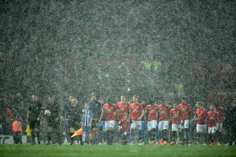 Snow joke: Man United overcame the extreme weather at Old Trafford to beat Brighton 2-0 in the FA Cup quarter-finals