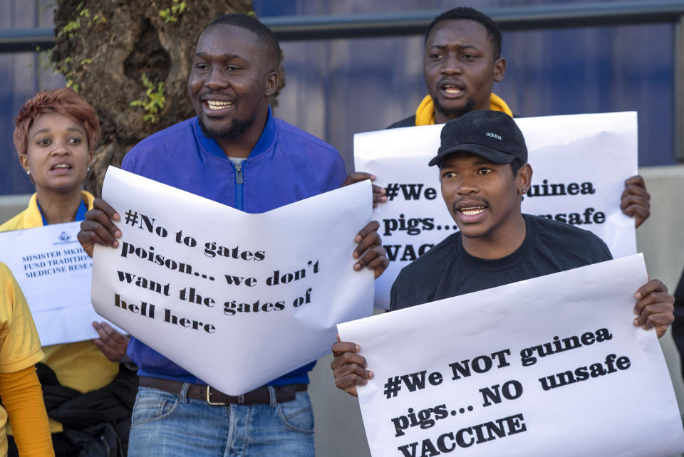 People protest against Coronavirus trials in Africa, outside the University of the Witwatersrand in Johannesburg, South Africa, Wednesday, July 1, 2020. A protest against Africa’s first COVID-19 vaccine trial is underway as experts note a worrying level of resistance and misinformation around testing on the continent. (AP Photo/Themba Hadebe)