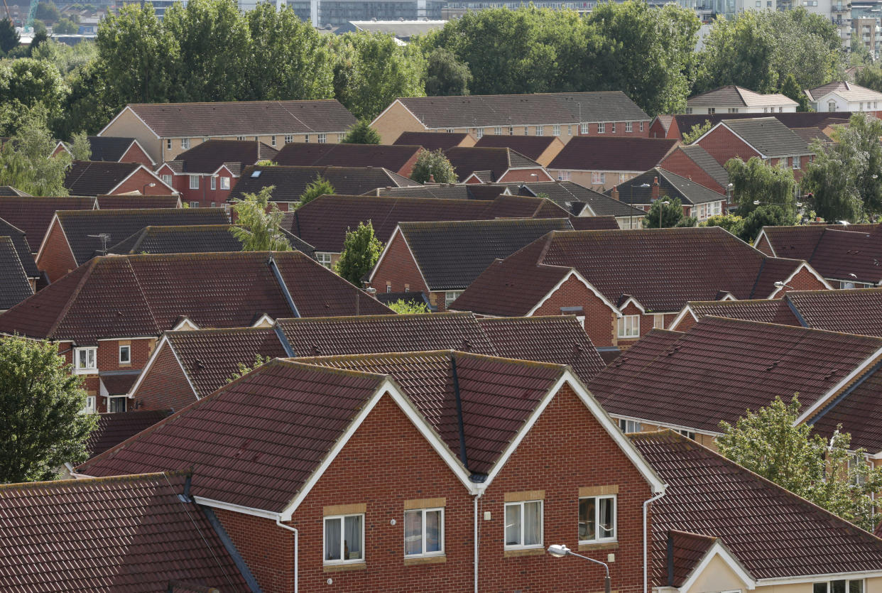 EMBARGOED TO 0001 WEDNESDAY OCTOBER 12 File photo dated 19/08/14 of a view of houses in Thamesmead, south east London, as homeowner anxiety about house values has cancelled out any reassurance from the Government's freeze on energy bills to drag down consumer confidence for another month, a survey suggests.