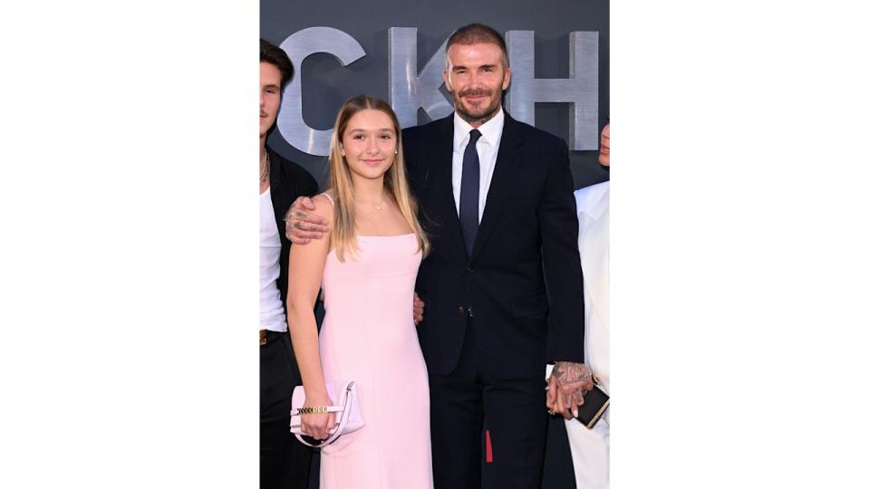 Harper Beckham stood with David