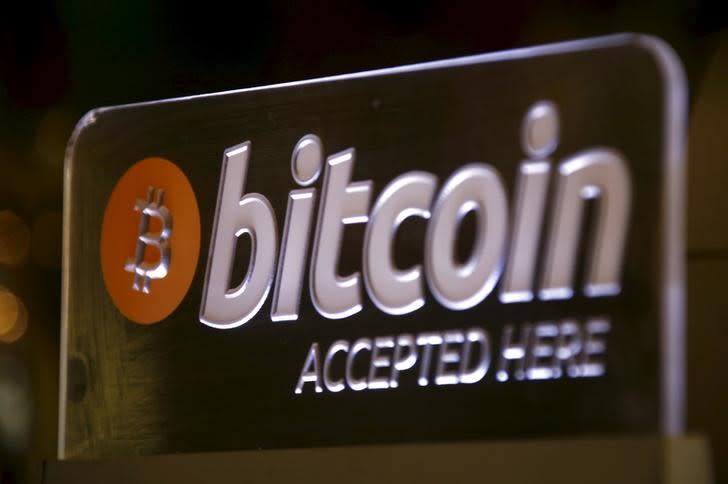 A Bitcoin sign can be seen on display at a bar in central Sydney, Australia, September 29, 2015. REUTERS/David Gray/Files