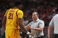 Iowa State coach T.J. Otzelberger, right, talks to Osun Osunniyi (21) during the first half of an NCAA college basketball game against Texas Tech, Monday, Jan. 30, 2023, in Lubbock, Texas. (AP Photo/Brad Tollefson)