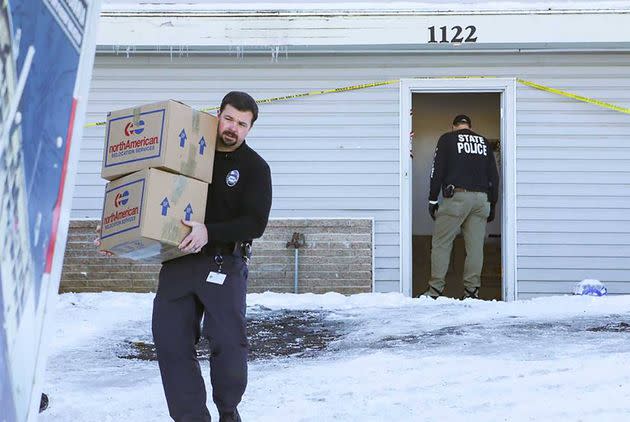 Moscow Police Capt. Anthony Dahlinger helps pack and remove the personal belongings of four University of Idaho homicide victims from their rental house. 