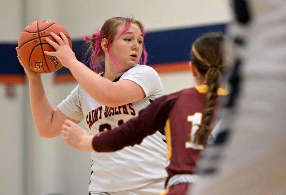 Saint Joseph’s Kelsey Prospero looks to make a pass around a Millersburg defender during the game on Wednesday, Jan. 17, 2024.