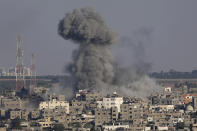 FILE - Smoke rises after Israeli airstrikes on a residential building in Gaza, Sunday, Aug. 7, 2022. (AP Photo/Adel Hana, File)