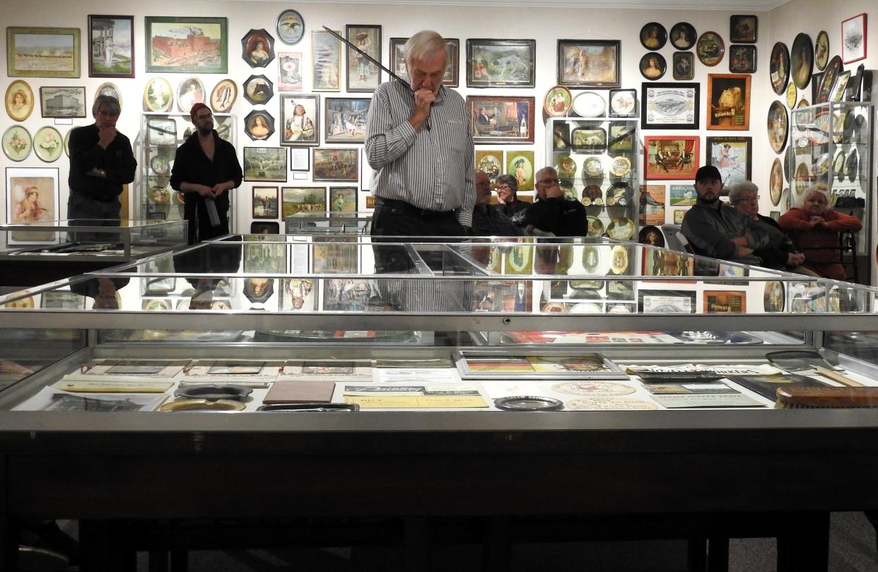 Joe Kreitzer points out items and talks about the history of specialty advertising in Coshocton from its origins in the 1880s when the industry started to die out in the 1950s. The special exhibit is on display through the end of the year at the Johnson Humrickhouse Museum.