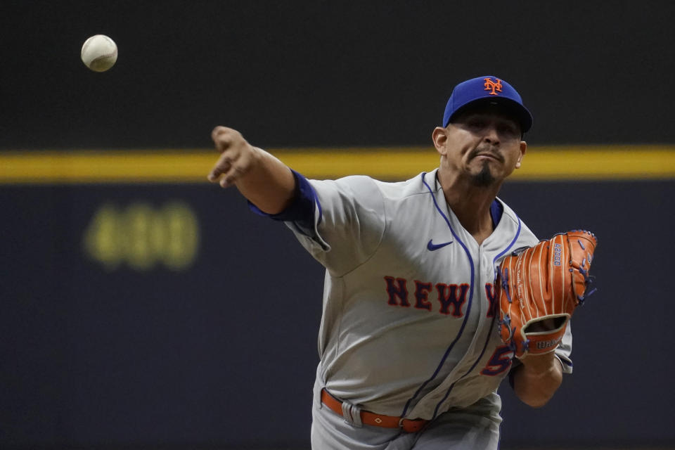 New York Mets' Carlos Carrasco pitches during the first inning of a baseball game against the Milwaukee Brewers Monday, April 3, 2023, in Milwaukee. (AP Photo/Aaron Gash)