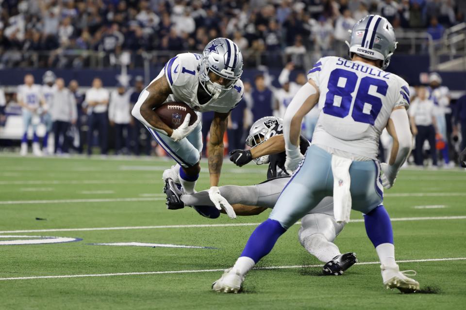 Dallas Cowboys wide receiver Cedrick Wilson (1) is stopped short of scoring on a two-point conversion attempt by Las Vegas Raiders safety Johnathan Abram, right rear, as tight end Dalton Schultz (86) looks on in the second half of an NFL football game in Arlington, Texas, Thursday, Nov. 25, 2021. (AP Photo/Michael Ainsworth)