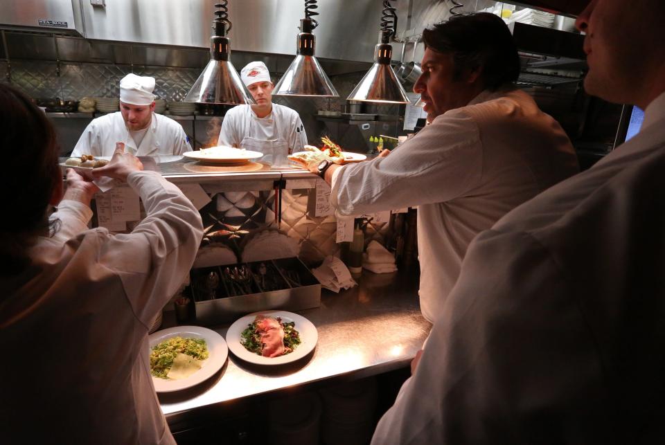 Bacco Ristorante owner Luciano Del Signore watches over plates being made before sending them out to patrons at his Southfield restaurant in 2013.