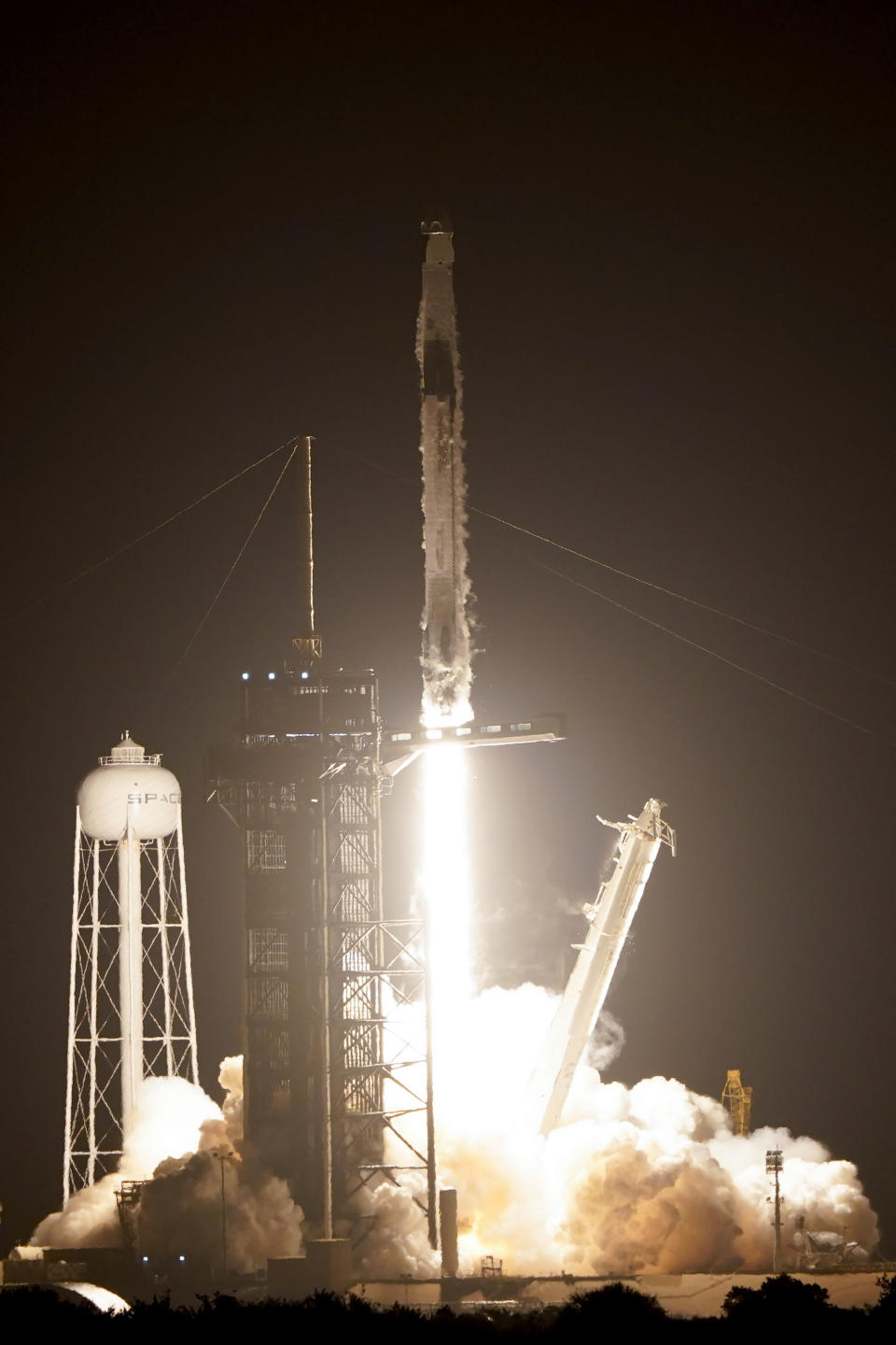 A SpaceX Falcon 9 rocket lifts off from pad 39A at the Kennedy Space Center in Cape Canaveral, Fla., Wednesday, April 27, 2022. NASA astronauts Kjell Lindgren, Robert Hines, and Jessica Watkins, and European Space Agency astronaut Samantha Cristoforetti on the Crew Dragon spacecraft begin a six-month expedition on the International Space Station. (AP Photo/John Raoux)