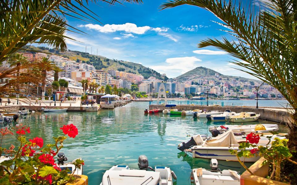 port with boats and flowers - Getty Images/iStockphoto 