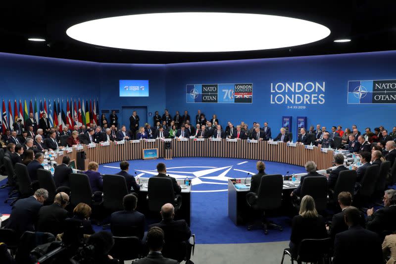 NATO heads of state attend the plenary session of the NATO summit at the Grove hotel in Watford