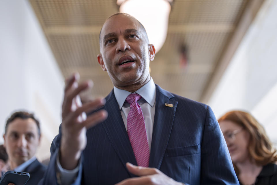 House Minority Leader Hakeem Jeffries, D-N.Y., walks with reporters after lawmakers pushed a $95 billion national security aid package for Ukraine, Israel and other U.S. allies closer to passage, at the Capitol in Washington, Friday, April 19, 2024. (AP Photo/J. Scott Applewhite)