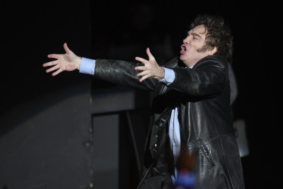 Argentine President Javier Milei sings at a promotional event for his new book in Buenos Aires, Argentina, Wednesday, May 22, 2024. (AP Photo/Gustavo Garello)
