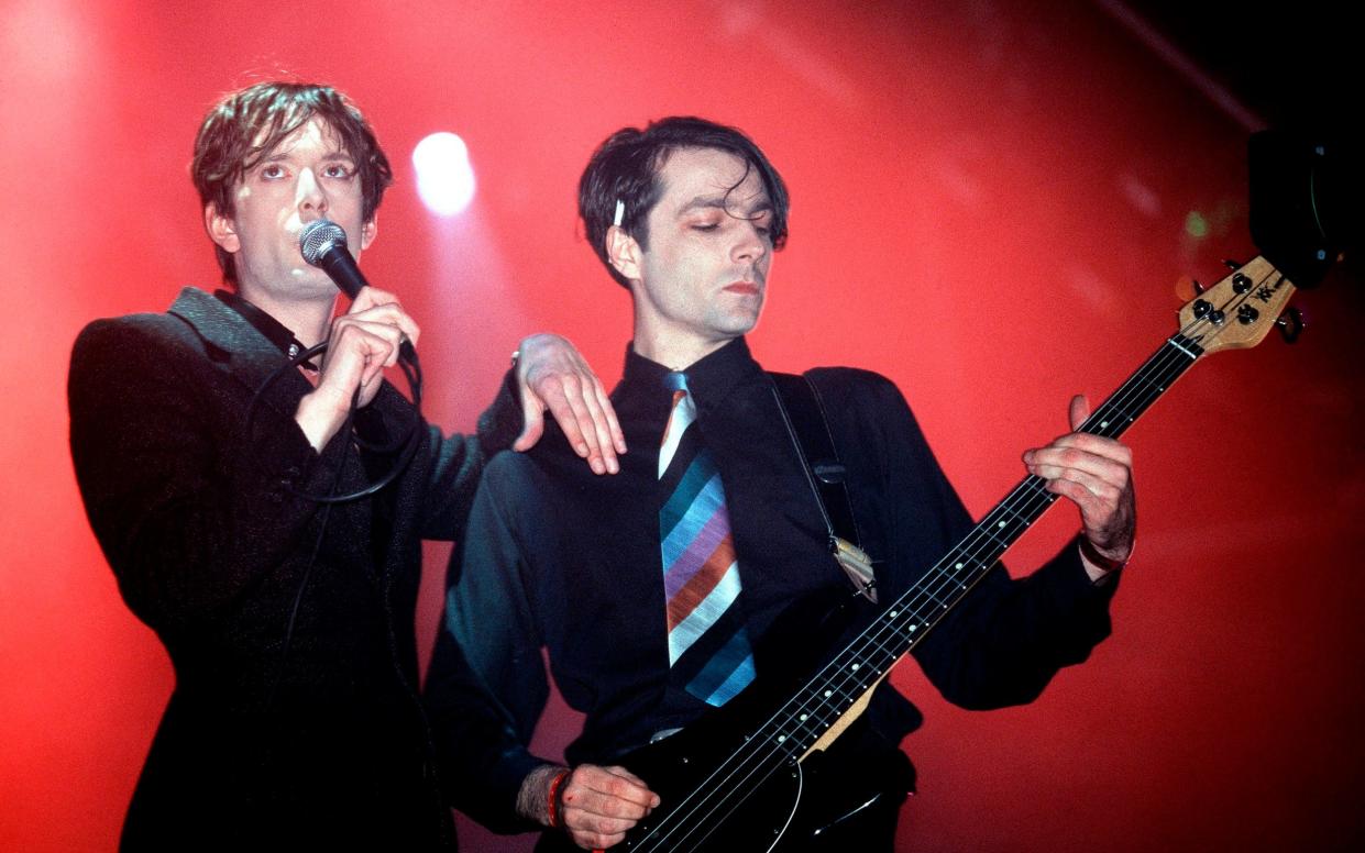 Steve Mackey on bass guitar with his Pulp bandmate Jarvis Cocker during their career-defining set at Glastonbury in 1995 - Mick Hutson/Redferns
