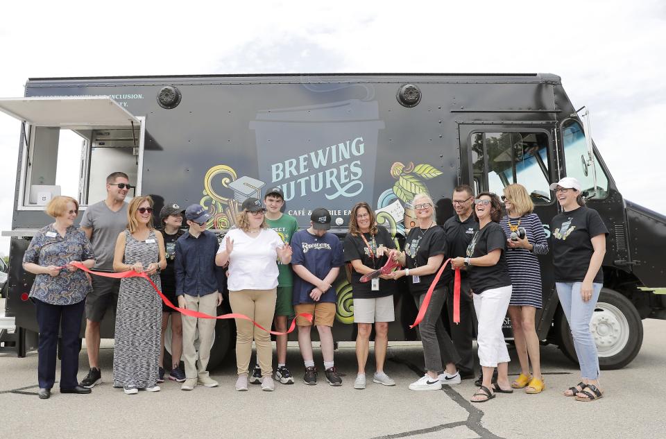 Oshkosh Area School District students and staff held a ribbon cutting Tuesday at the Oshkosh Area School District for Brewing Futures Mobile Cafe. The school district's new mobile classroom and food truck launched in June and will make appearances at events throughout the summer.