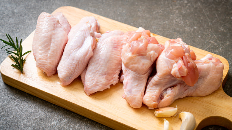 Raw wings on a cutting board