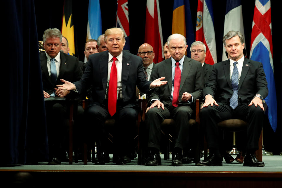 President Donald Trump onstage with Attorney General Jeff Sessions and FBI Director Christopher Wray as he participates in a graduation ceremony at the FBI Academy in Quantico, Virginia, on Dec. 15, 2017. (Photo: Jonathan Ernst / Reuters)