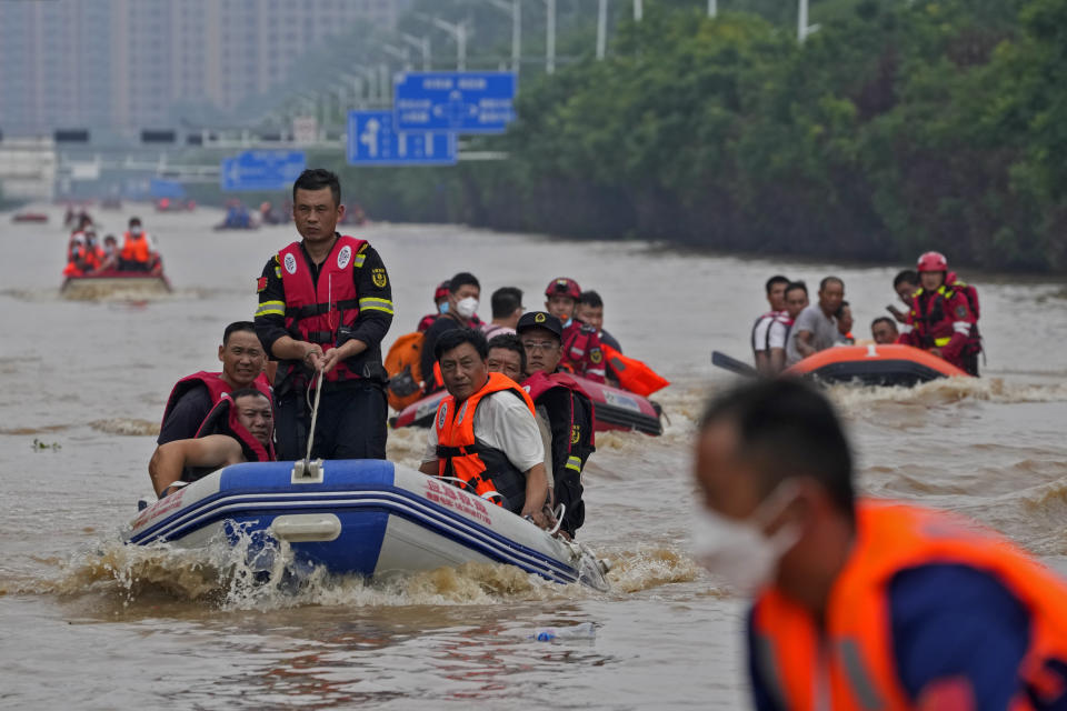 Residents evacuate on rubber boats through floodwaters in Zhuozhou in northern China's Hebei province, south of Beijing, Wednesday, Aug. 2, 2023. China's capital has recorded its heaviest rainfall in at least 140 years over the past few days. Among the hardest hit areas is Zhuozhou, a small city that borders Beijing's southwest. (AP Photo/Andy Wong)