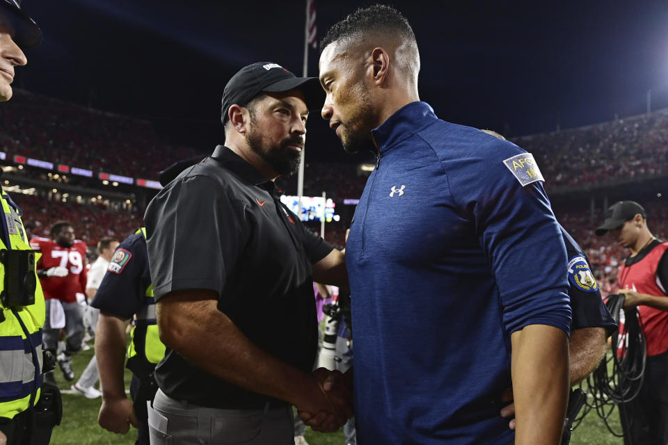 Ohio State head coach Ryan Day, left, and Notre Dame head coach Marcus Freeman, right, shake hands after an NCAA college football game Saturday, Sept. 3, 2022, in Columbus, Ohio. (AP Photo/David Dermer)