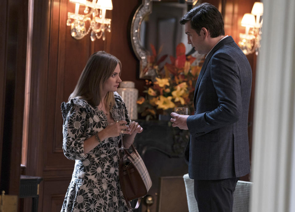 This image released by HBO shows Francesa Root-Dodson, left, holding a designer bag, and Nicholas Braun in a scene from "Succession." For the rich and those who aspire, logo-free fashion with outsized price tags is having a moment. Michelle Matland, costume designer for the series, has created pricey yet stealth wardrobes unique to key characters. (Macall Polay/HBO via AP)