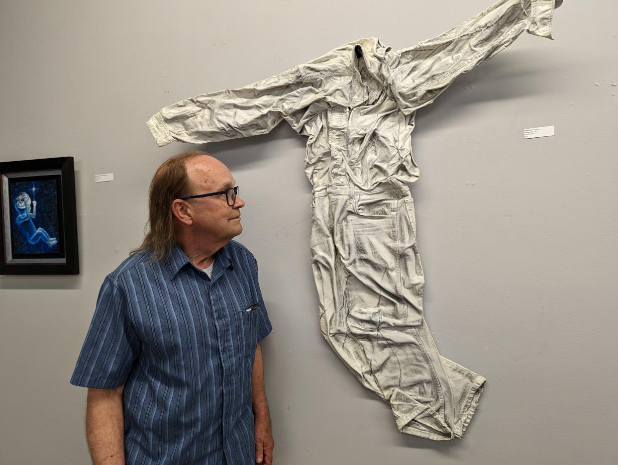 Canton artist Tom Wachunas' newest exhibit, "Signs and Wonderings: A Disciple's Journey" showcases abstract expressions of his spiritual experiences. This piece is called "Draw Clothes to Him."