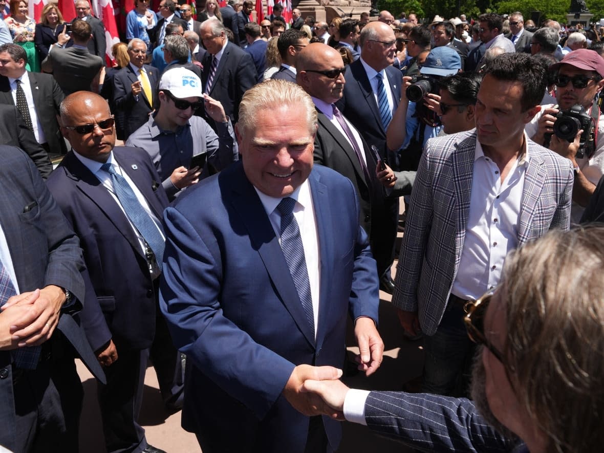 Premier Doug Ford greets members of the crowd following the swearing-in ceremony of his new cabinet at Queen's Park on June 24, 2022. (Nathan Denette/The Canadian Press - image credit)