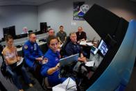 NASA commercial crew astronauts Nicole Mann and and Mike Fincke and Boeing astronaut Chris Ferguson run through scenarios in a simulation cockpit of the Boeing Starliner spaceship at the Johnson Space Center in Houston