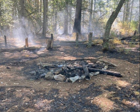 An illegal campfire sparked a wildfire that burned 2.75 acres in the Burlingame Management Area on the Charlestown-Hopkinton line Aug. 14, the DEM says.