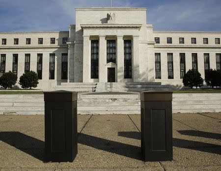 The United States Federal Reserve Board building is shown behind security barriers in Washington October 28, 2014. REUTERS/Gary Cameron