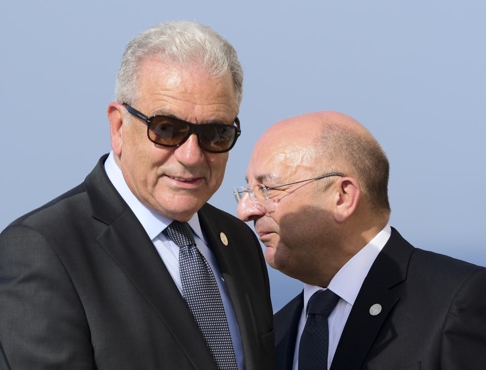 EU commissioner for migration Dimitris Avramopoulos, left, is flanked by Maltese Interior Minister Michael Farrugia during a joint press conference at the end of an informal meeting of EU interior ministers, at Fort St. Angelo, in Birgu, Malta, Monday, Sept. 23, 2019. Five European Union nations have agreed to a temporary arrangement to take in migrants rescued from the central Mediterranean Sea. (AP Photo/Jonathan Borg)