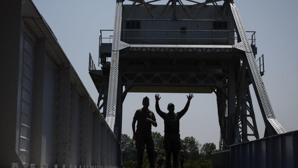 Servicemen walk on Pegasus Bridge, one of the first sites liberated by Allied forces from Nazi Germany, in Benouville, Normandy, Monday June 5, 2023. (Thomas Padilla/AP)