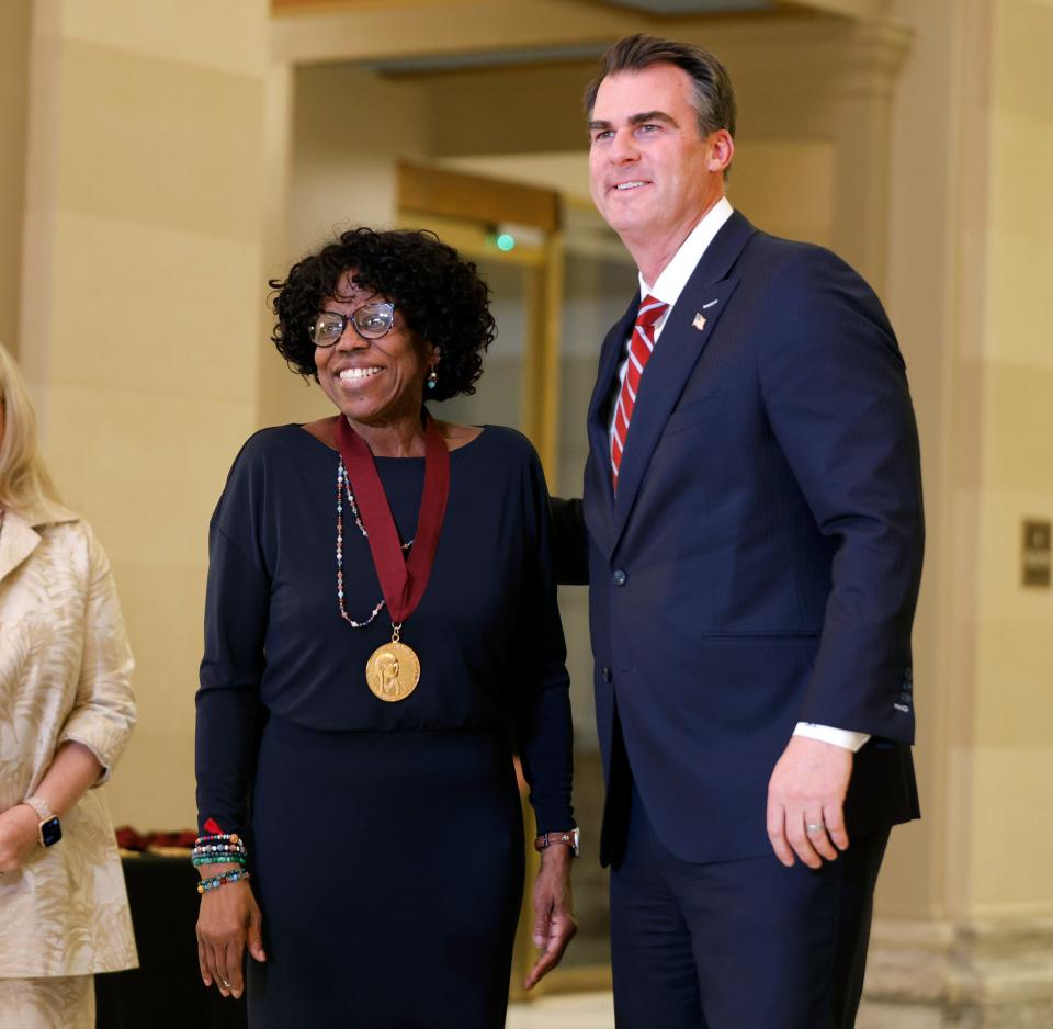 Penny McGill is given the Arts in Education Award by Gov. Kevin Stitt on Tuesday, Jan. 30, 2024, during the 45th Annual Governor's Arts Awards.