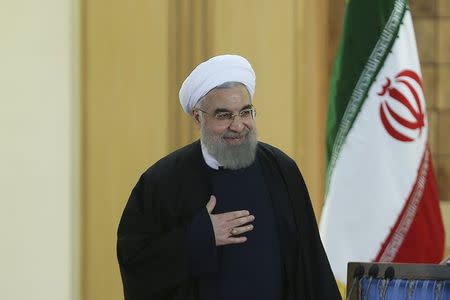 Iranian President Hassan Rouhani gestures as he arrives for a news conference in Tehran, Iran January 17, 2016. REUTERS/President.ir/Handout