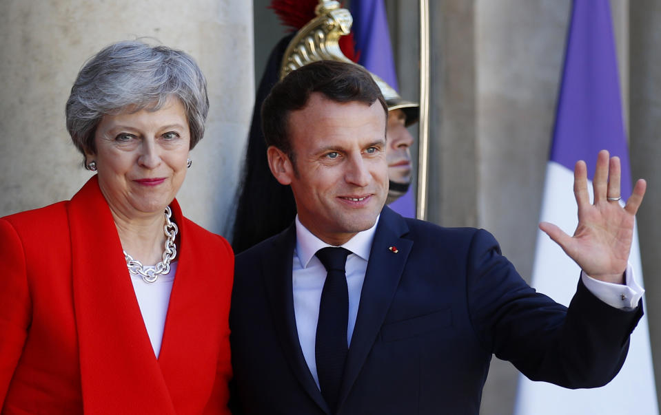 French President Emmanuel Macron, right, greets British Prime Minister Theresa May at the Elysee Palace, in Paris, Wednesday, May 15, 2019. Several world leaders and tech bosses are meeting in Paris to find ways to stop acts of violent extremism from being shown online.(AP Photo/Francois Mori)
