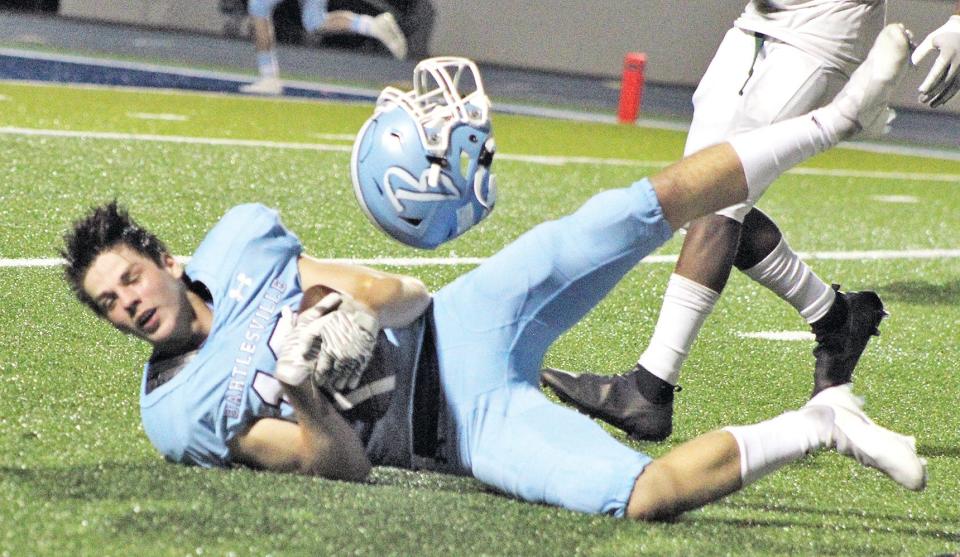 Junior receiver Eli Lino holds on to a catch for the Bartlesville High Bruins during one of their impressive offensive drives against Muskogee last season.