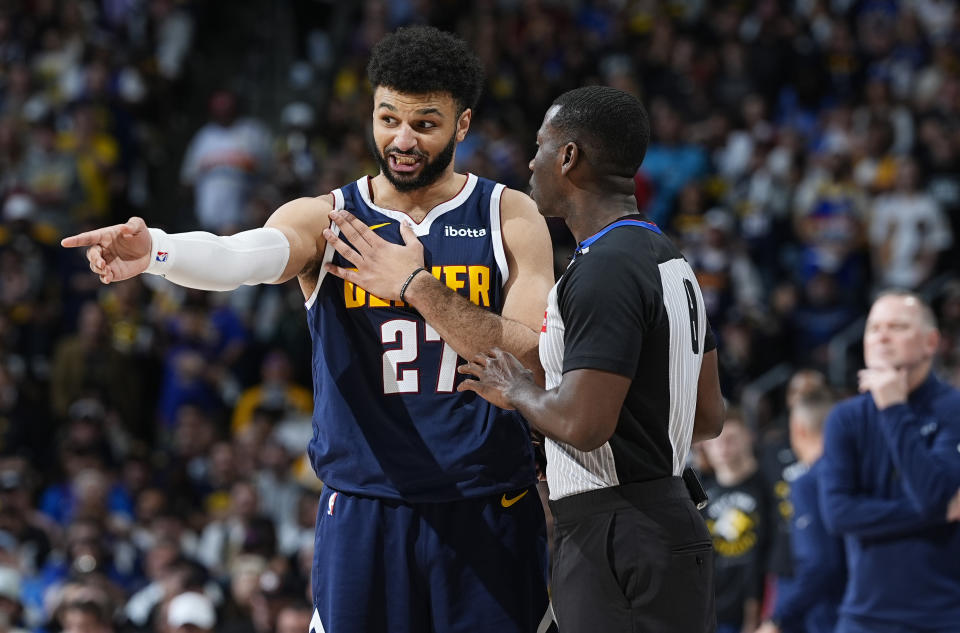 Denver Nuggets guard Jamal Murray, left, argues with referee James Williams in the second half of Game 5 of an NBA basketball first-round playoff series against the Los Angeles Lakers Monday, April 29, 2024, in Denver. (AP Photo/David Zalubowski)