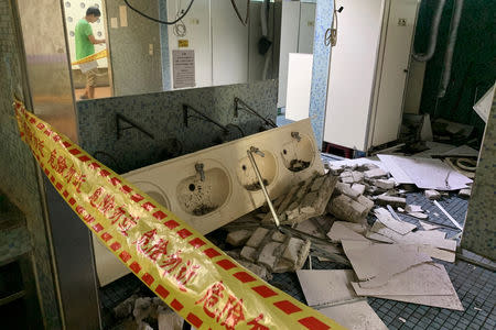 A damaged washroom is seen in a university after an earthquake in Taipei, Taiwan April 18, 2019. REUTERS/Tyrone Siu