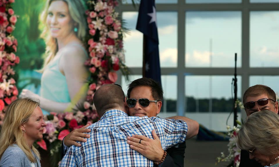 Ms Ruszczyk-Damond's fiancé Don Damond is comforted at the service. Photo: AP