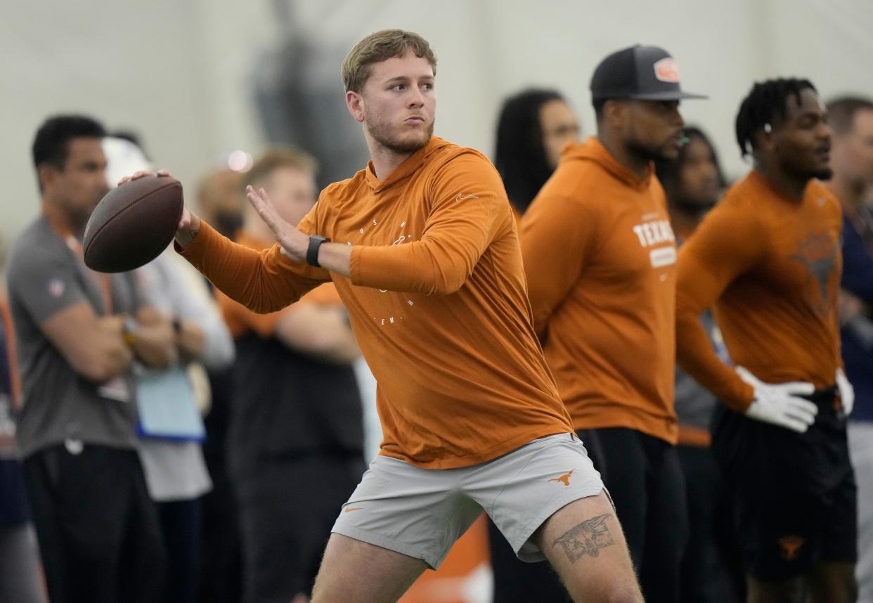 Texas quarterback Quinn Ewers threw to NFL hopefuls at UT's pro timing day at Denius Fields on Wednesday. Scouts took notice of his accuracy on passes to former teammates Xavier Worthy, Adonai Mitchell, Ja'Tavion Sanders and Keilan Robinson.