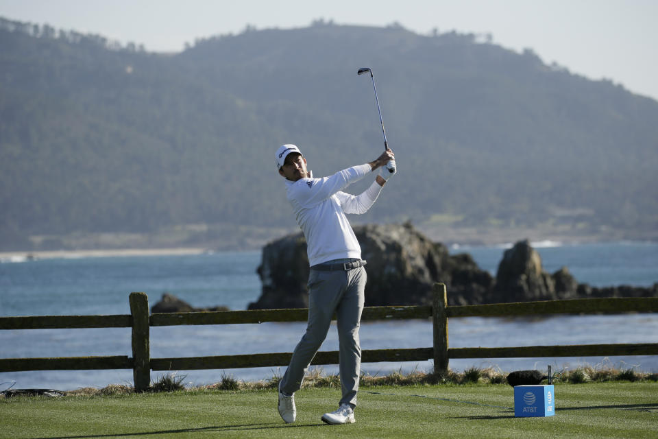 Nick Taylor, of Canada, follows his drive from the 18th tee of the Pebble Beach Golf Links during the final round of the AT&T Pebble Beach National Pro-Am golf tournament Sunday, Feb. 9, 2020, in Pebble Beach, Calif. (AP Photo/Eric Risberg)