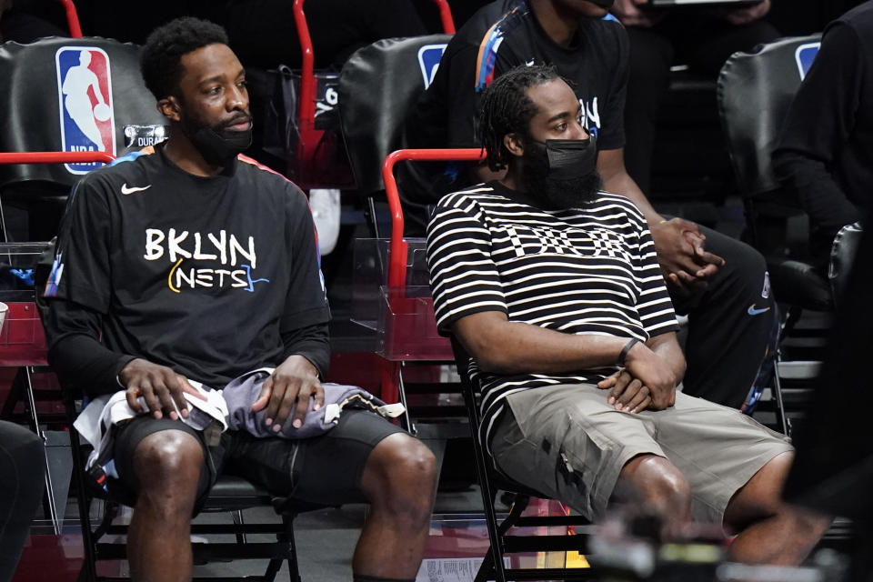 Brooklyn Nets' Jeff Green, left, and James Harden, right, watch during the second half of the team's NBA basketball game against the New Orleans Pelicans on Wednesday, April 7, 2021, in New York. (AP Photo/Frank Franklin II)