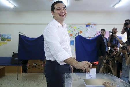 Greek Prime Minister Alexis Tsipras casts his ballot at a polling station in Athens, Greece July 5, 2015. REUTERS/Alkis Konstantinidis