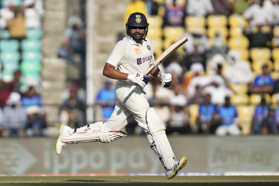 India's captain Rohit Sharma runs between the wickets to score during the first day of the first cricket test match between India and Australia in Nagpur, India, Thursday, Feb. 9, 2023. (AP Photo/ Rafiq Maqbool)