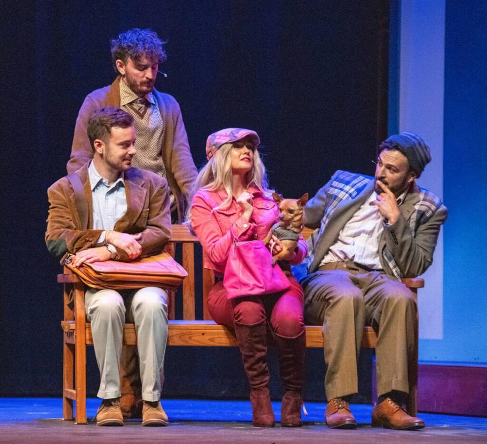 Becca Andrews as Elle Woods holds Cha Cha as her best pal Bruiser while, from left, Stephen Christopher Anthony, AJ Cola and Diego Klock-Pérez consider the new addition to Harvard Law in “Legally Blonde the Musical” at Actors’ Playhouse.