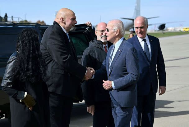 PHOTO: President Joe Biden is greeted by Pennsylvania Lieutenant Governor John Fetterman after disembarking Air Force One at Philadelphia International Airport in Philadelphia, Oct. 20, 2022. (Mandel Ngan/AFP via Getty Images)