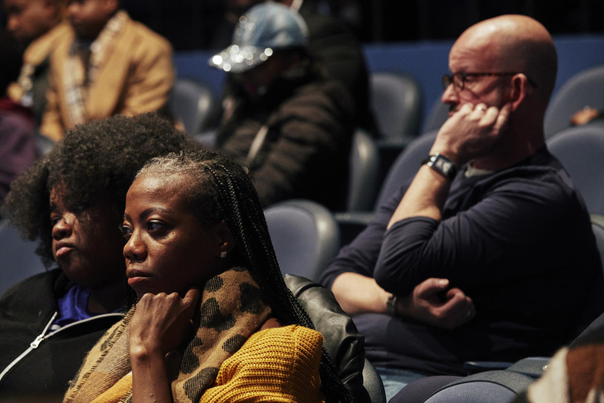 Chicagoans listen to a mayoral debate between Paul Vallas and Brandon Johnson (Mustafa Hussain for NBC News)